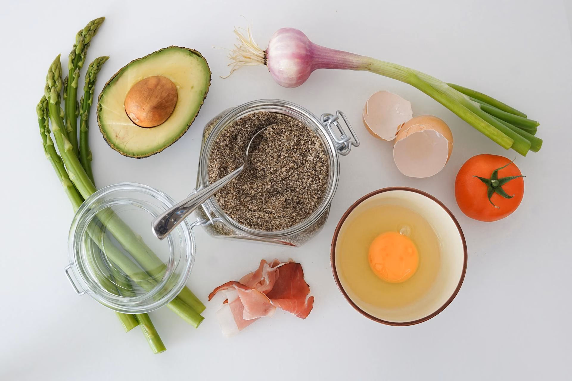 A flat-lay of keto-friendly whole foods